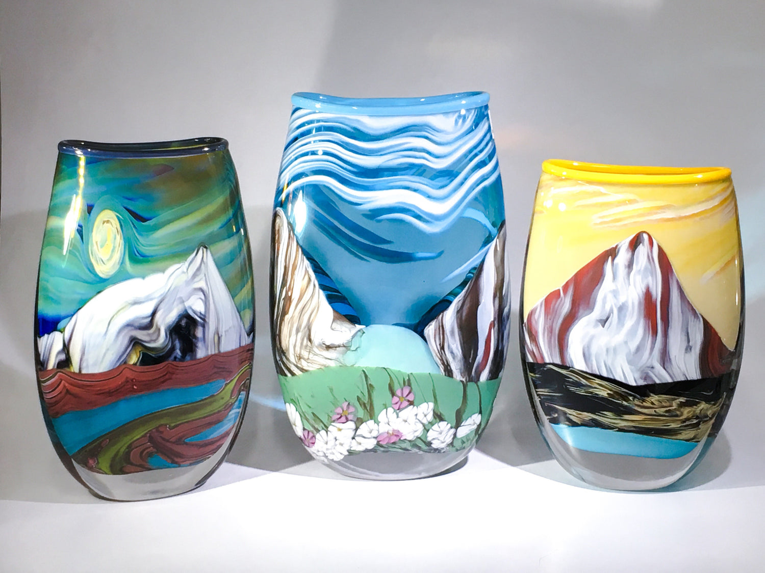 Summit Vase, hand made blown glass vase with mountain imagery of coloured glass embedded in the piece.
